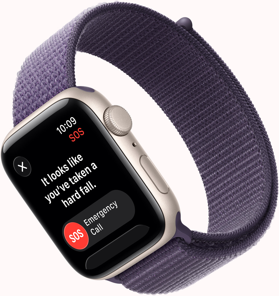 Apple Watch SE 3, casing aluminium, warna putih pucat metalik, pemberitahuan SOS Deteksi Jatuh, tombol panggilan darurat dan saya baik-baik saja, eksterior sisi kanan, Digital Crown, mikrofon, tombol samping, tali jam, Loop Sport, warna ungu kabut