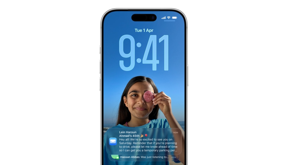iPhone Lock Screen with photo, numerals for time in Liquid Glass, two notifications appear on bottom of screen iPhone Lock Screen with photo, numerals for time in Liquid Glass, two notifications appear on bottom of screen